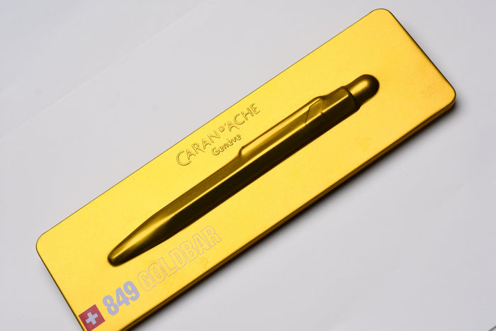 Caran d'Ache 849 Metal Ballpoint Pen - Goldbar With Metal Slim Pack Case