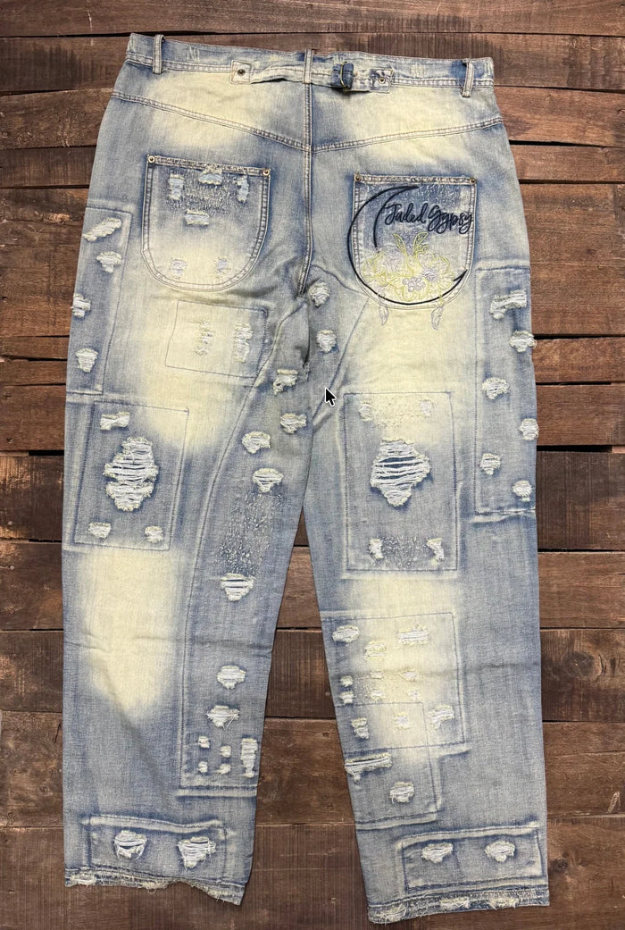 Jaded Gypsy Denim Peace And Love Jeans with distressed patchwork details, faded blue wash, embroidered back design, and rolled cuffs