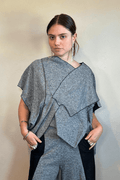 Model wearing the Kozan Fari draped top in heathered gray with black contrast edging, shown from front and back, including a full outfit view with coordinating pants.