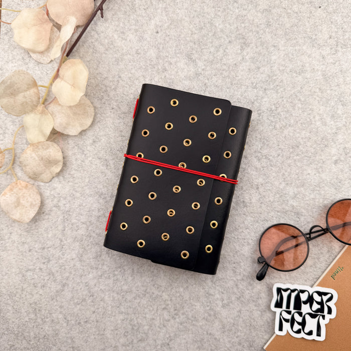 Imperfect Concepts Juniper Leather Notebook - A6  Trifold - Black w/ Gold Grommets