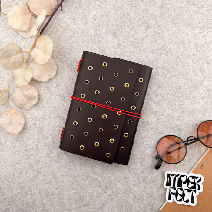 Imperfect Concepts Juniper Leather Notebook - A6  Trifold - Dark Brown w/ Gold & Brass Grommets