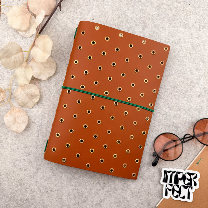 Imperfect Concepts Thatcher Leather Notebook - A5 Bifold - Cognac w/ Gold Grommets