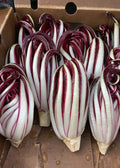 Red and white striped radicchio in a cardboard box