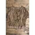 Brown sheer floral lace coverlet with long gathered sleeves and multiple ribbon ties, shown flat on a rustic wood background.